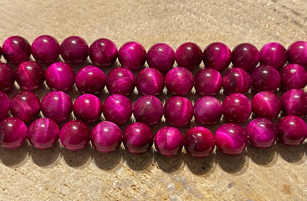 Perles en pierre naturelle en Oeil de Tigre rose en 8 mm - les bijoux de Thea 