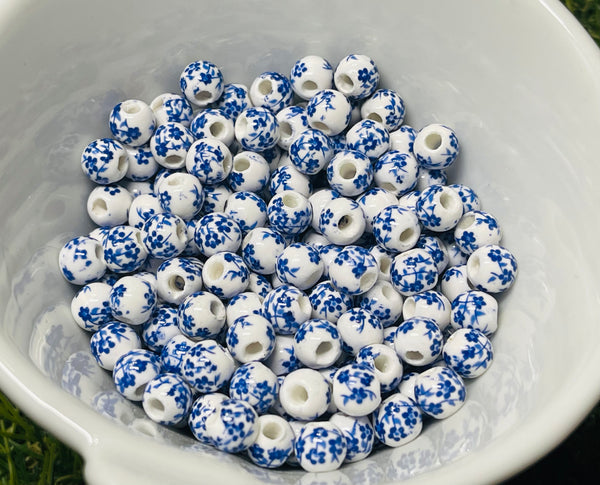 Lot de 10 Intercalaires Perles en céramique fleurs bleues pour bracelet
- les bijoux de Thea 