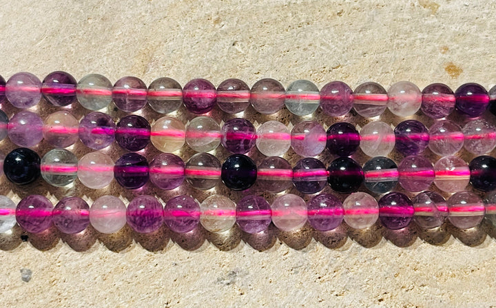 Perles en pierre naturelle en Fluorite violette en 6 mm - les bijoux de Thea 