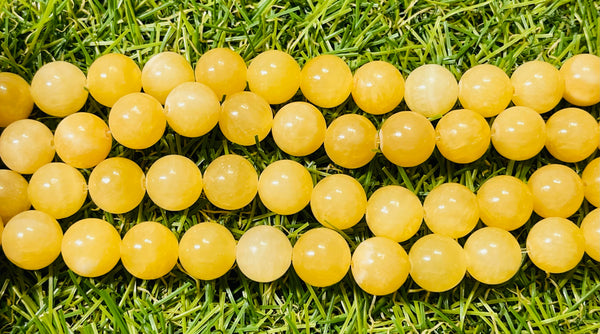 Perles naturelles en Jade jaune miel en 10 mm - Les bijoux de Théa