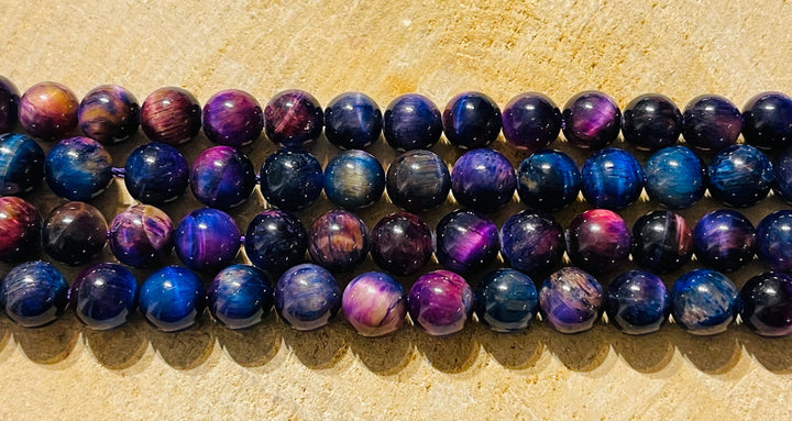 Perles en pierre naturelle en Oeil de Tigre violet arc en ciel en 8 mm - les bijoux de Thea 