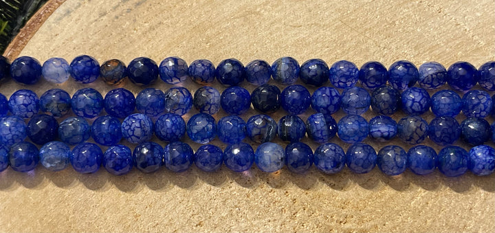 Perles naturelles en Agate veine de dragon facettée bleue en 8 mm - Les bijoux de Théa