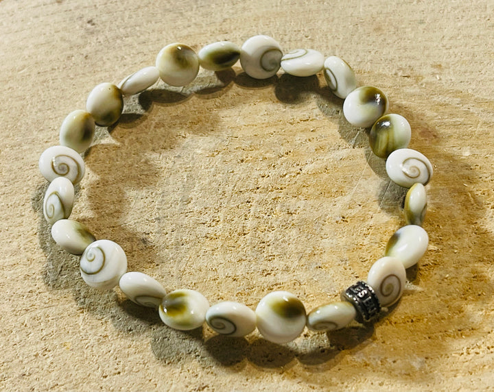 Bracelet en perles naturelles Œil de Sainte Lucie / Shiva 8 mm - les bijoux de Thea 
