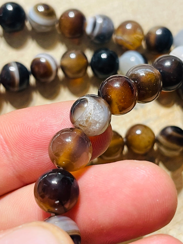 Perles en pierre naturelle en Agate marron noir en 10 mm - les bijoux de Thea 