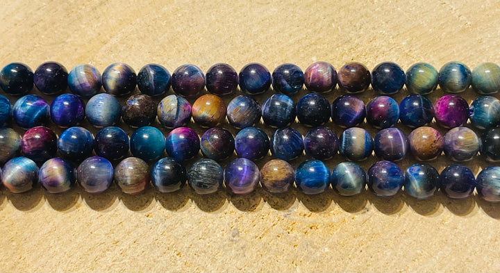 Perles naturelles en Oeil de Tigre violet arc en ciel en 8 mm - les bijoux de Thea 