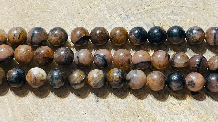 Perles en Chiastolite en 8 mm - les bijoux de Thea 
