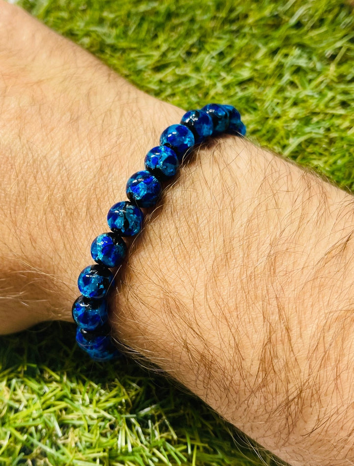 Bracelet en perles Lumineuses bleues en 8 mm - Les bijoux de Théa