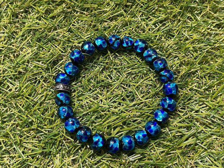 Bracelet en perles Lumineuses bleues en 8 mm - Les bijoux de Théa