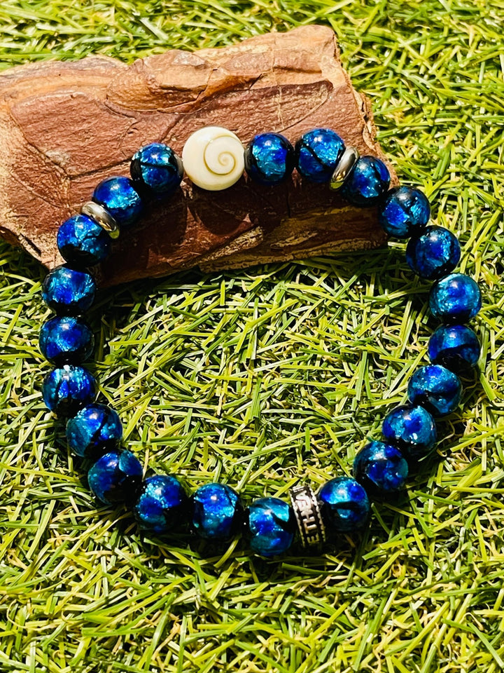 Bracelet "SEA" en perles Lumineuses bleues 8 mm et Oeil de Sainte Lucie / Shiva - Les bijoux de Théa