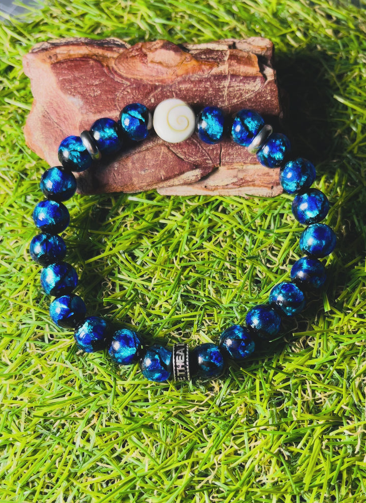 Bracelet "SEA" en perles Lumineuses bleues 8 mm et Oeil de Sainte Lucie / Shiva - les bijoux de Thea 