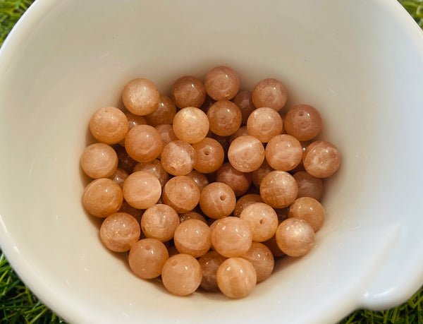 Perles naturelles en Pierre de Soleil en 8 mm (lot de 10) - Les bijoux de Théa